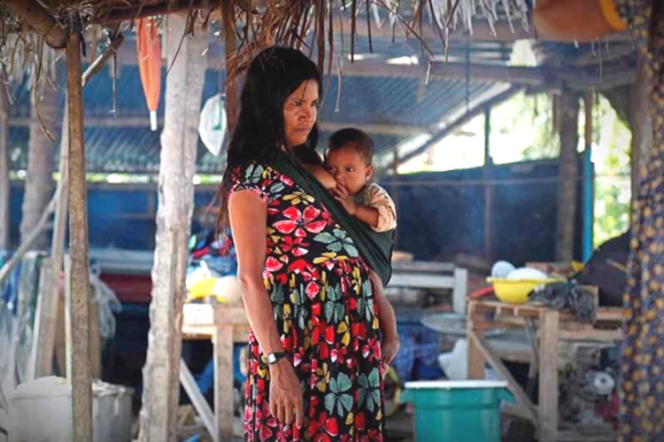 Latin American woman experiencing motherhood in poverty