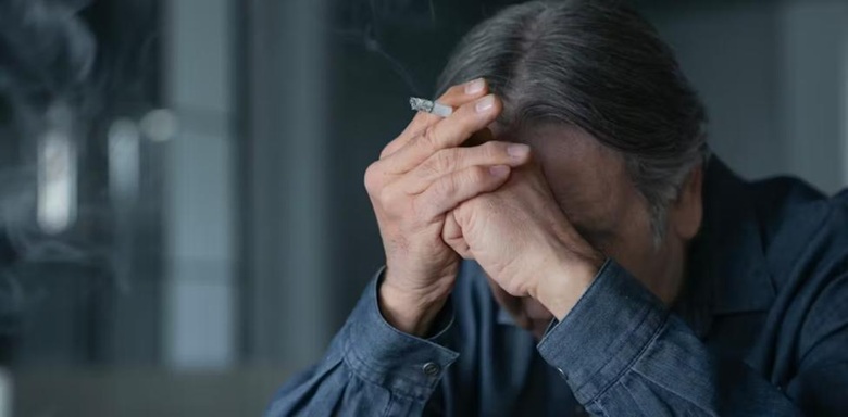 Depressed person with head in hands Depressed person with head in hands