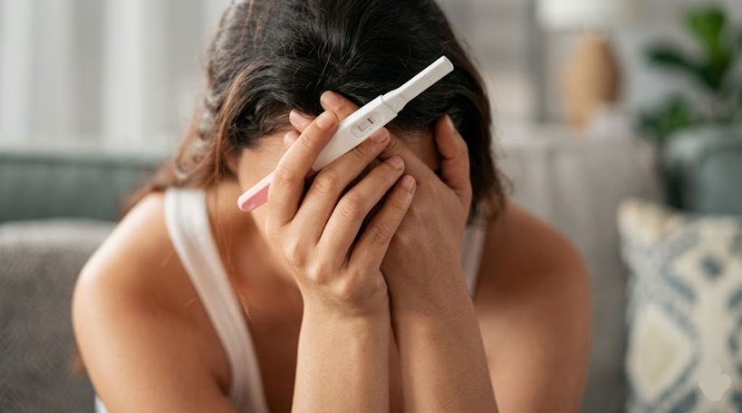Young woman distressed about being pregnant